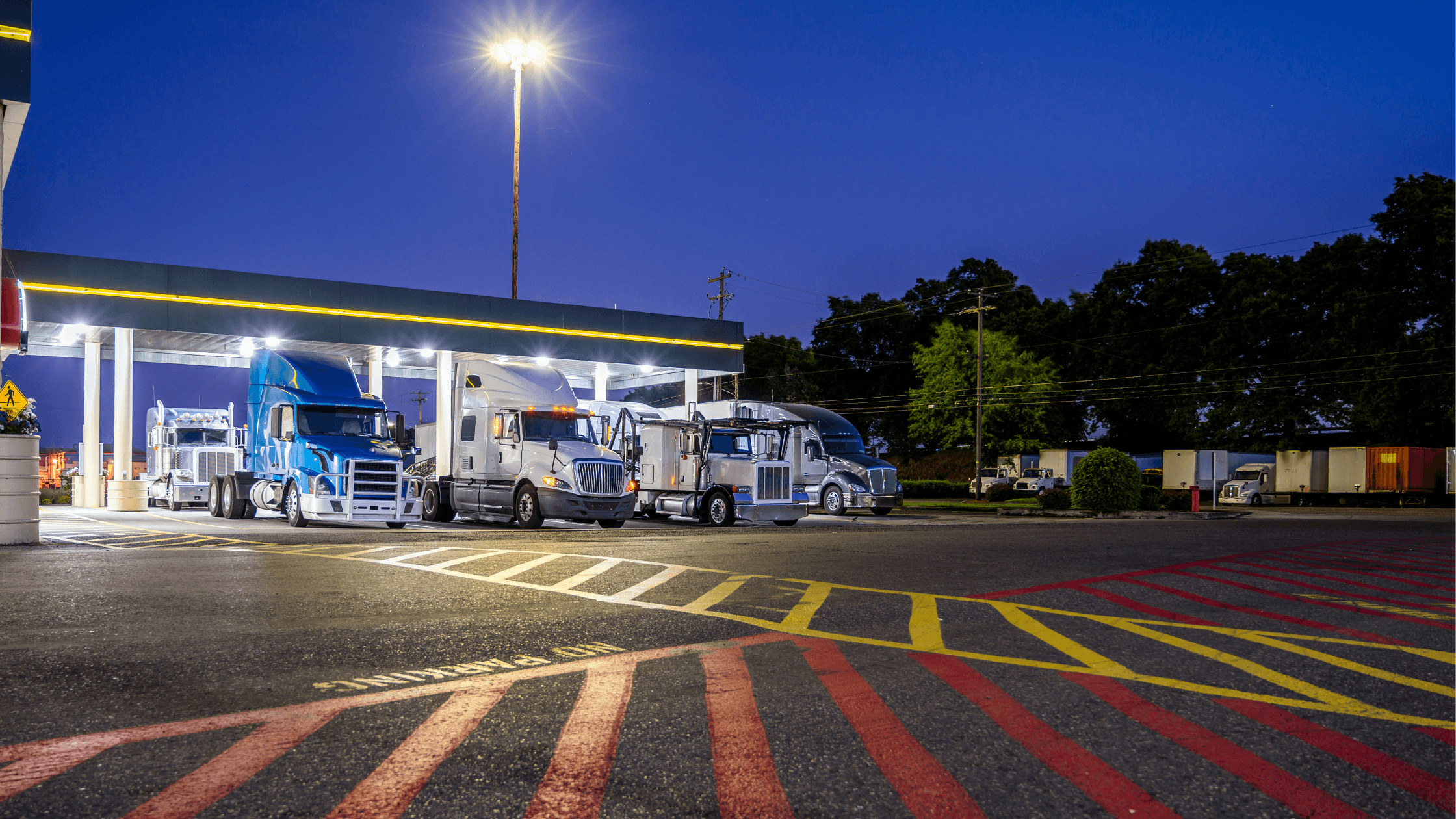 rofessional image of a commercial truck parked securely at Superior Truck Parking lot near I-75 in Calhoun, Georgia, showing paved spaces and security features.